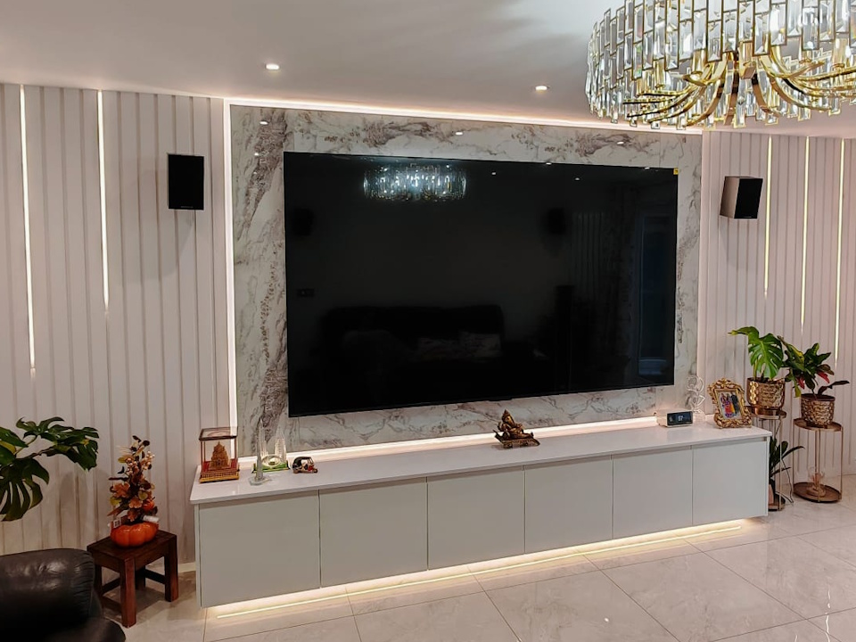 Media wall with floating gloss units, marble-effect surround and LED-lit slatted panelling